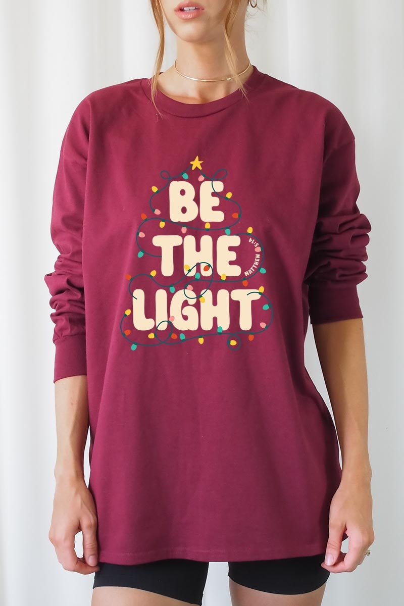 UL240P-E3202 Be the Light Christmas Graphic Plus Long Sleeve Tee $17