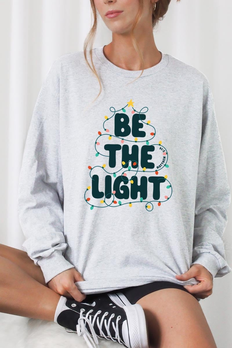 UL240P-E3202 Be the Light Christmas Graphic Plus Long Sleeve Tee $17