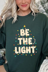 UL180P-E3202 Be the Light Christmas Graphic Plus Sweatshirt $25
