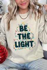 UL180P-E3202 Be the Light Christmas Graphic Plus Sweatshirt $25