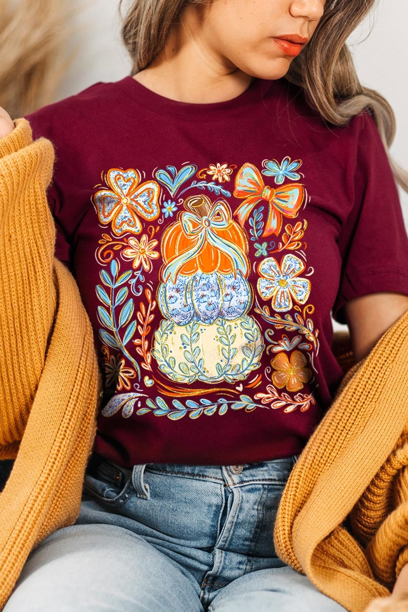 US3001P-E3153 Floral Pumpkin Stack Graphic Plus Tee $16