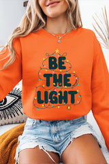 UL180-E3202 Be the Light Christmas Graphic Sweatshirt $20