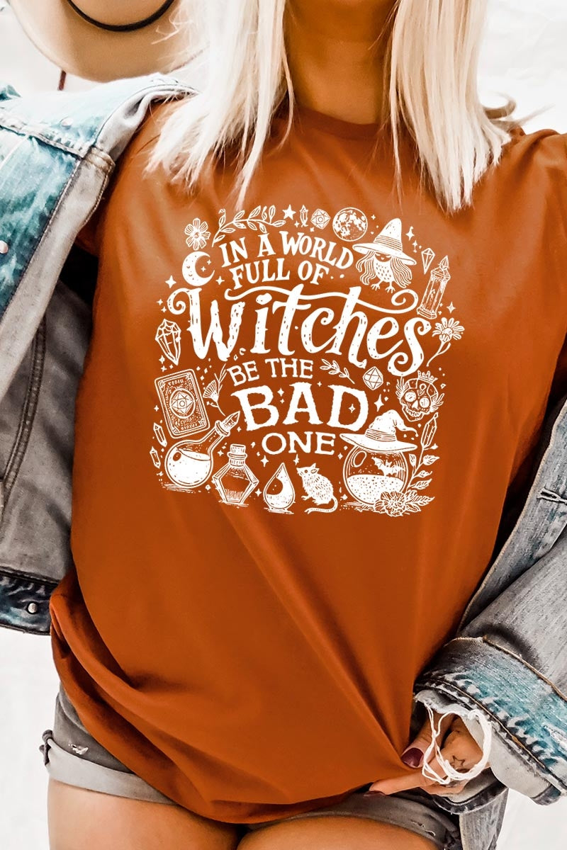 US3001-E3139 In a World of Witches Graphic Tee $12.5