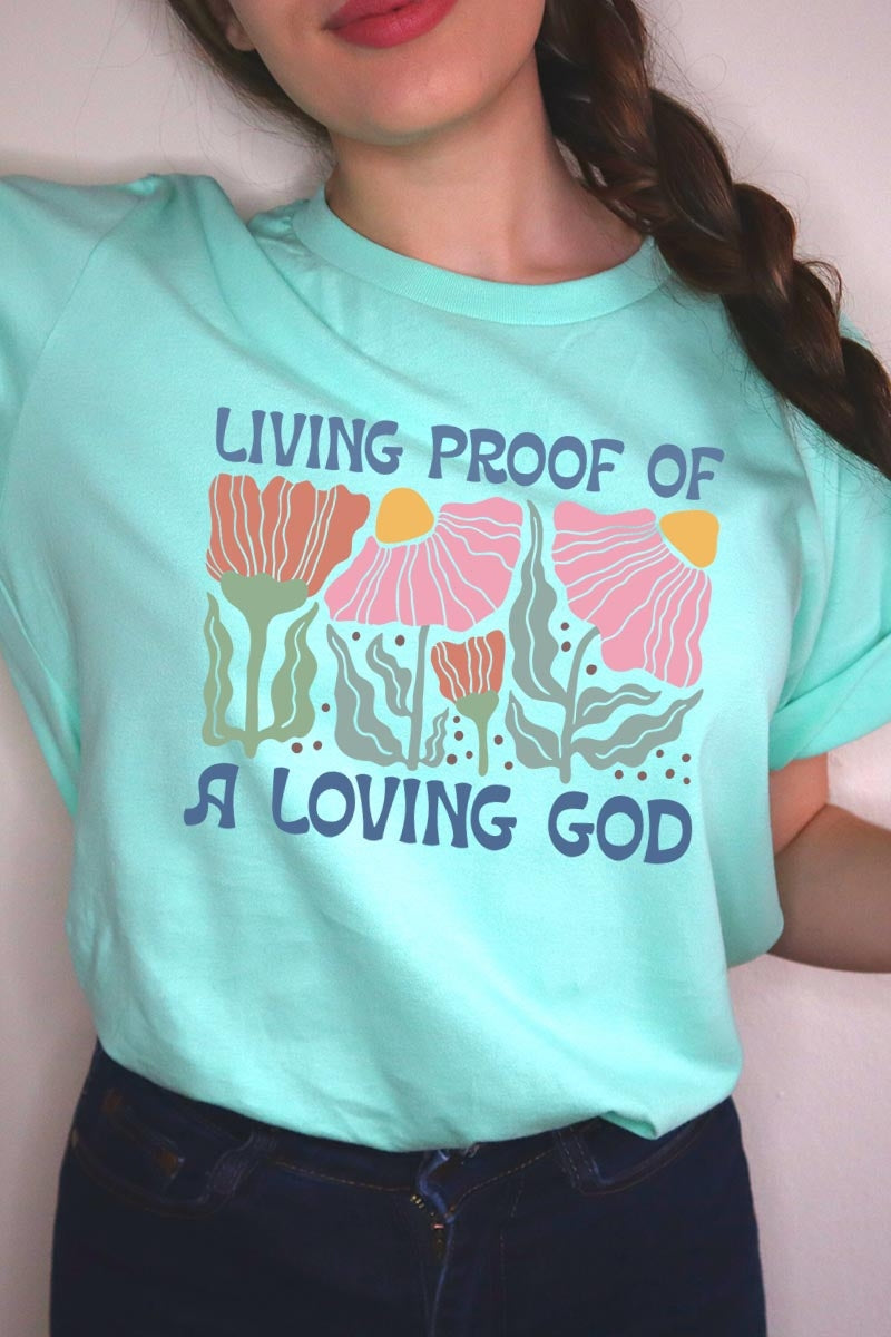 US3001-E3066 Living Proof of a Loving God Graphic Tee $12.5