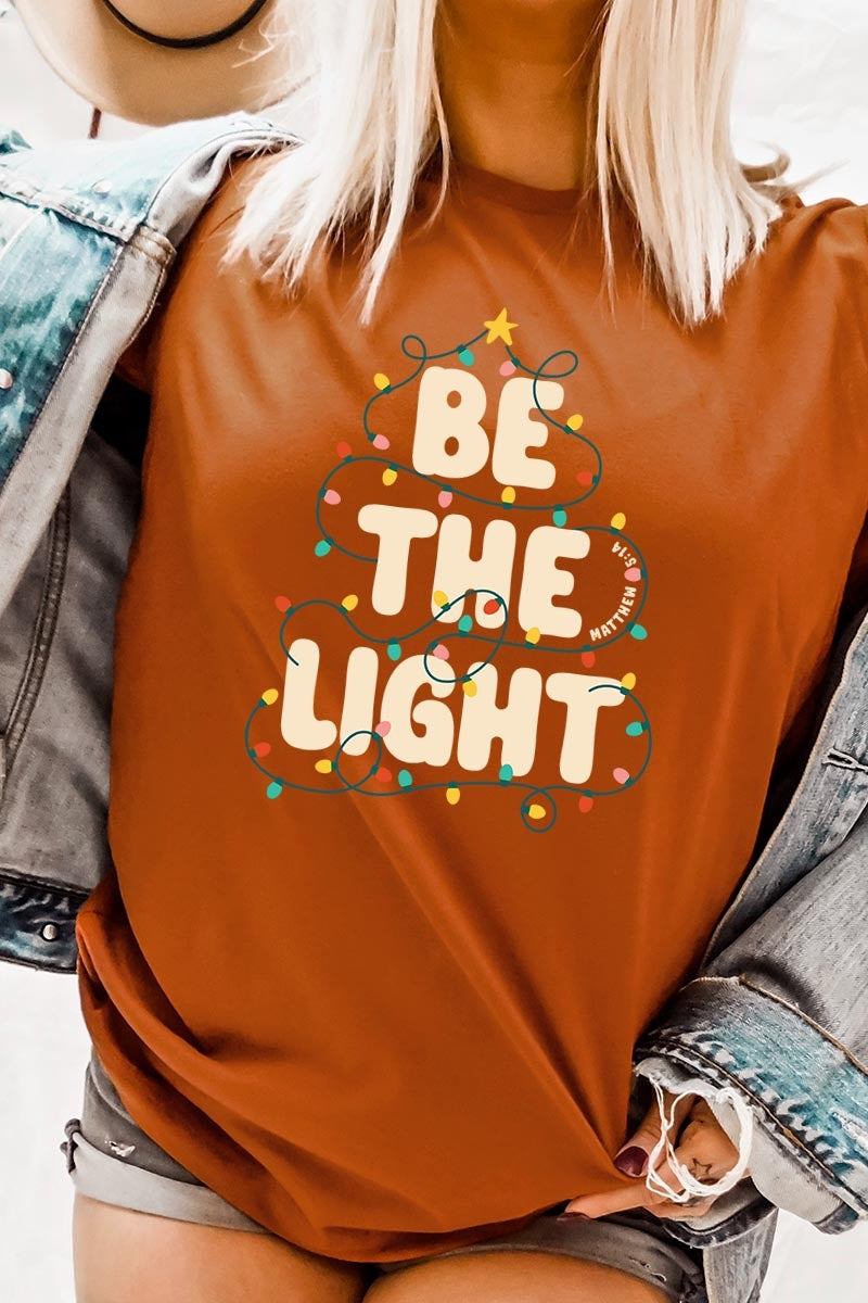 US3001-E3202 Be the Light Christmas Graphic Tee $12.5
