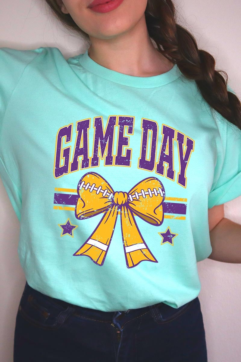 US3001P-E3063 Purple Game Day Football Bow Graphic Plus Tee $16
