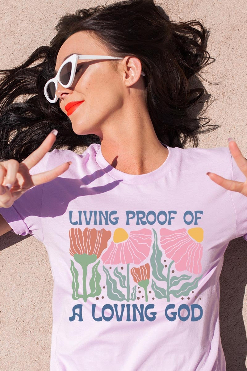 US3001P-E3066 Living Proof of a Loving God Graphic Plus Tee $16