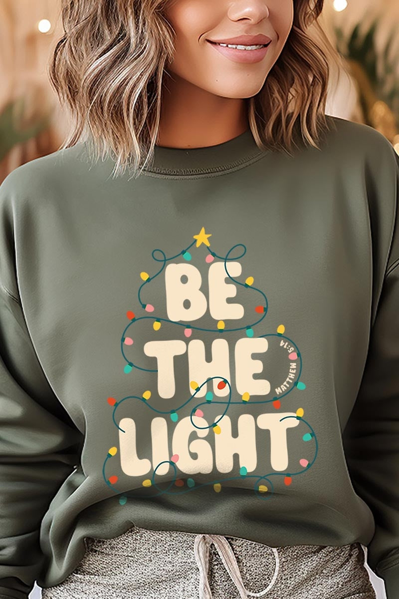 UL180P-E3202 Be the Light Christmas Graphic Plus Sweatshirt $25