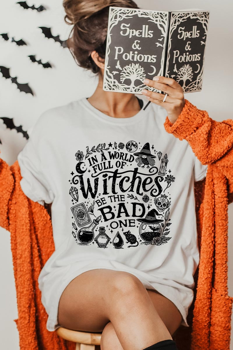 US3001P-E3139 In a World of Witches Graphic Plus Tee $16