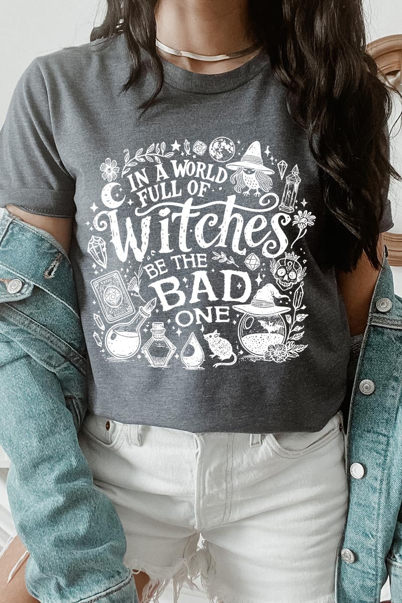 US3001-E3139 In a World of Witches Graphic Tee $12.5